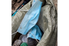 Image Medical masks in a trash bag.